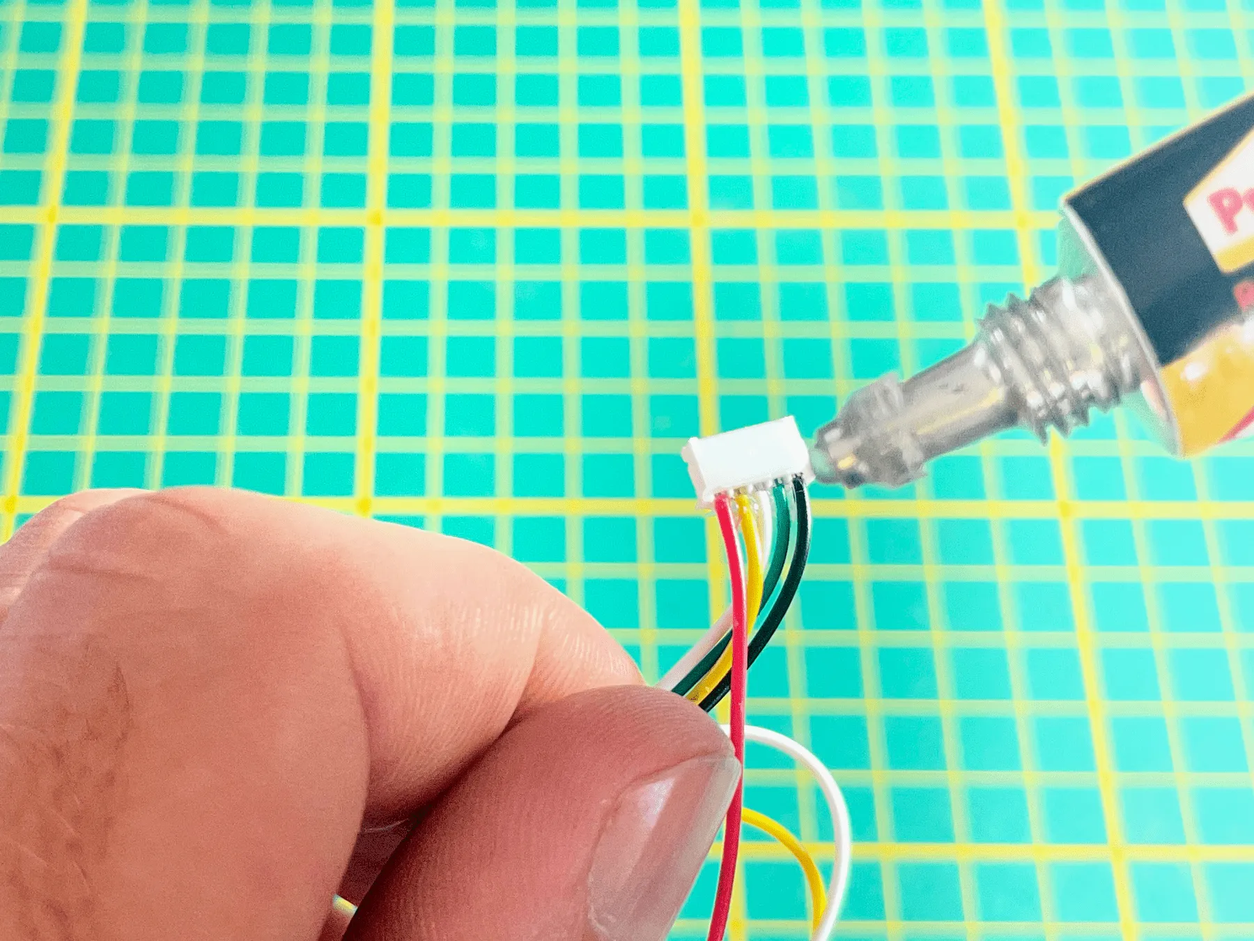 Flexible adhesive added near the SPS30 connector for strain relief