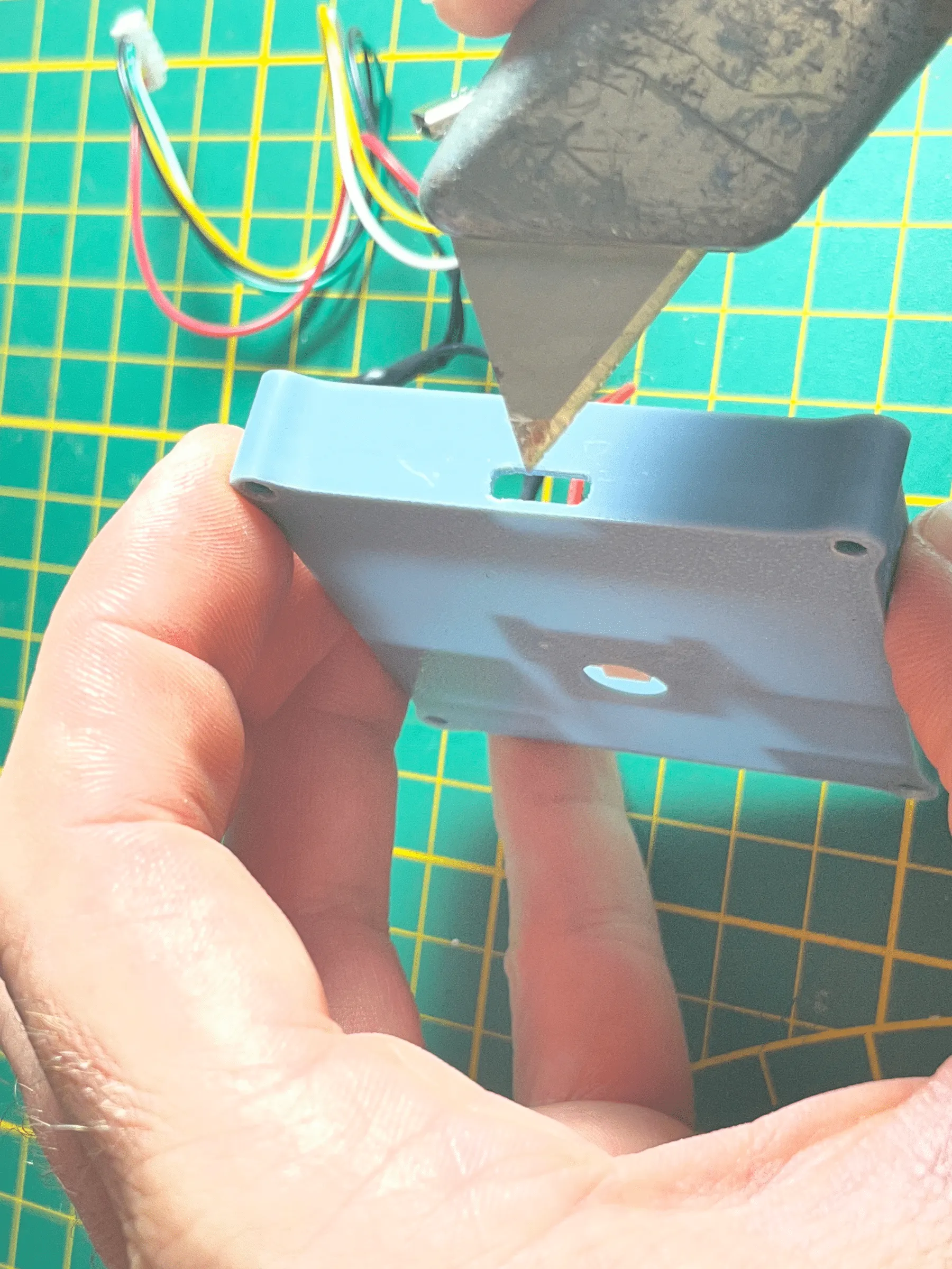 Trimming the SuperMini enclosure USB opening with a hobby knife