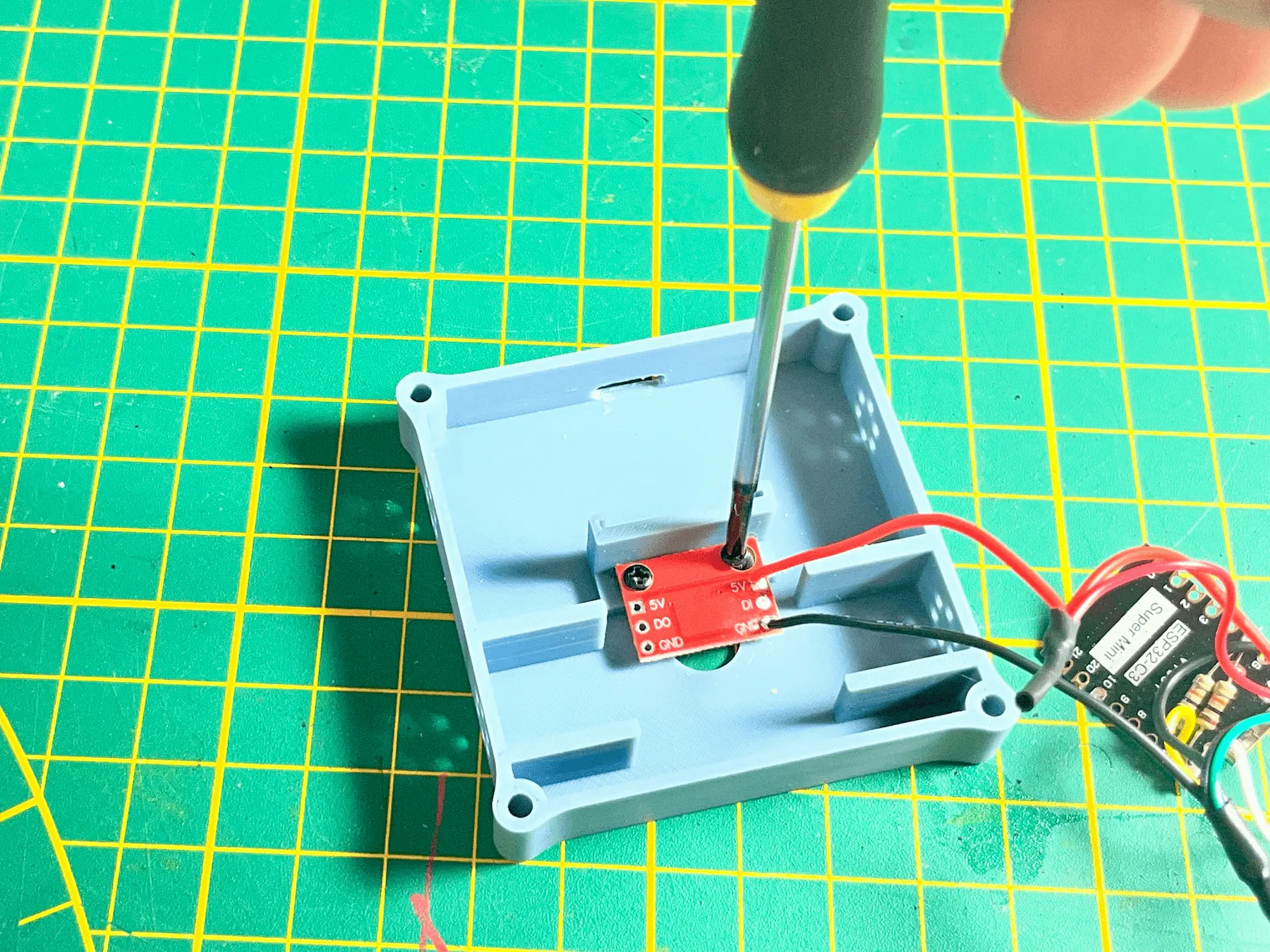 WS2812 RGB LED board mounted with two short screws