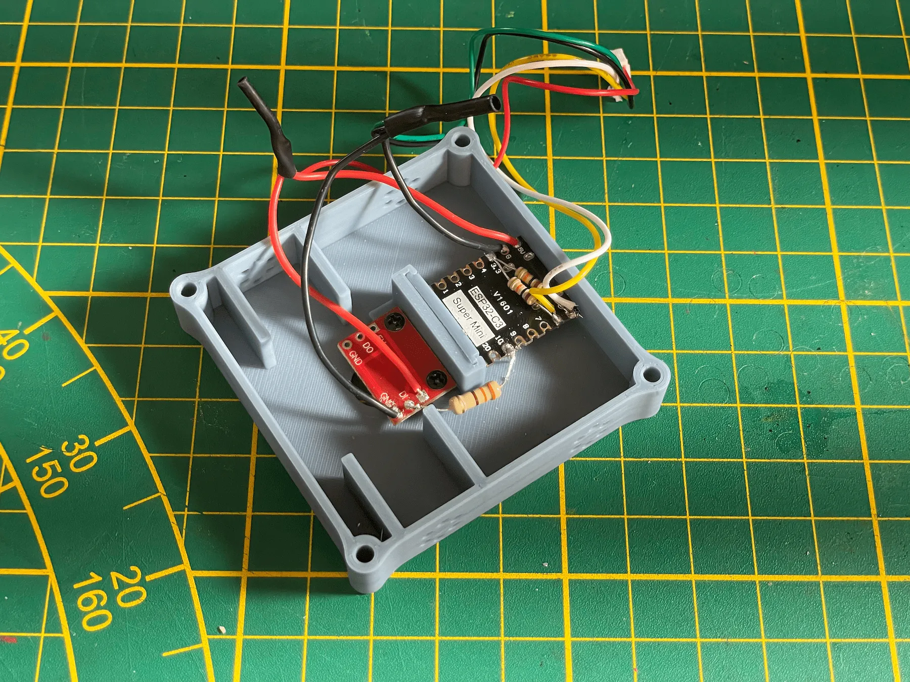 330 ohm resistor folded neatly around the divider wall and soldered in place